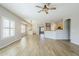 Open-concept living room featuring tile floors, neutral walls, and plantation shutters, providing a bright and airy space at 6317 S Kimberlee Way, Chandler, AZ 85249