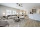 Open-concept living space with wood floors, recessed lighting, and ample natural light at 6317 S Kimberlee Way, Chandler, AZ 85249