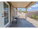The covered patio has outdoor seating for enjoying the backyard at 6317 S Kimberlee Way, Chandler, AZ 85249