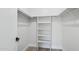 Walk-in closet offers shelving, hanging racks, and neutral paint at 6629 N Majorca E Way, Phoenix, AZ 85016