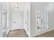 Bright entryway featuring hard surface floors, modern chandelier, and updated door at 6629 N Majorca E Way, Phoenix, AZ 85016