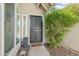 Charming front entrance with security door and decorative plant, creating a welcoming appeal at 6629 N Majorca E Way, Phoenix, AZ 85016