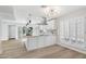 Modern kitchen featuring a large island, stainless appliances, and bright white cabinetry at 6629 N Majorca E Way, Phoenix, AZ 85016