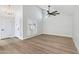 Bright, open-concept living space with wood flooring and shuttered windows at 6629 N Majorca E Way, Phoenix, AZ 85016