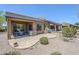 An outdoor patio space with landscaping and desert views at 7094 E Palo Brea Dr, Gold Canyon, AZ 85118