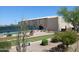 Wide angle of bocce ball court, landscaping, picnic tables, and nearby building at 7094 E Palo Brea Dr, Gold Canyon, AZ 85118