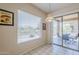 Cozy breakfast nook features window and sliding glass doors to covered patio at 7094 E Palo Brea Dr, Gold Canyon, AZ 85118