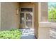 Close-up of the front door featuring a decorative security screen and textured walls at 7094 E Palo Brea Dr, Gold Canyon, AZ 85118