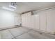 Clean garage featuring an abundance of built-in cabinets for storage at 7094 E Palo Brea Dr, Gold Canyon, AZ 85118