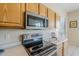 Close up on kitchen features stainless steel microwave and stove top oven at 7094 E Palo Brea Dr, Gold Canyon, AZ 85118