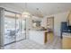 Bright kitchen features stainless steel sink, appliances, and views to outdoor patio at 7094 E Palo Brea Dr, Gold Canyon, AZ 85118