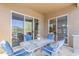 Outdoor patio furnished with a table and four chairs near sliding glass doors at 7094 E Palo Brea Dr, Gold Canyon, AZ 85118