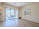Open living room with access to patio with mountain views, wood floor and natural light at 7094 E Palo Brea Dr, Gold Canyon, AZ 85118