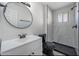 Updated bathroom features a modern vanity, lighting, and sleek black fixtures at 7101 N 36Th Ave # 102, Phoenix, AZ 85051
