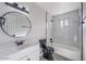 Bathroom boasting updated fixtures, bathtub, and large vanity mirror at 7101 N 36Th Ave # 102, Phoenix, AZ 85051