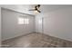 Bedroom with light walls, modern flooring, window and closet with sliding doors at 7101 N 36Th Ave # 102, Phoenix, AZ 85051
