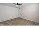 Bedroom featuring modern flooring, neutral paint, and standard door at 7101 N 36Th Ave # 102, Phoenix, AZ 85051