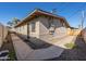 Exterior shot of property with block wall, gravel landscaping and walkway at 7101 N 36Th Ave # 102, Phoenix, AZ 85051