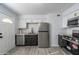 Updated kitchen features stainless steel appliances, stone countertops and tile floors at 7101 N 36Th Ave # 102, Phoenix, AZ 85051