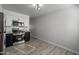 This contemporary kitchen offers stainless steel appliances, stone countertops and tile floors at 7101 N 36Th Ave # 102, Phoenix, AZ 85051