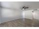Bright living room featuring modern flooring and a ceiling fan at 7101 N 36Th Ave # 102, Phoenix, AZ 85051