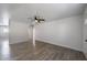 Open-concept living area with wood-look flooring and a ceiling fan at 7101 N 36Th Ave # 102, Phoenix, AZ 85051