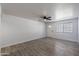 Bright, updated living room featuring tile floors, ceiling fan, and lots of natural light at 7101 N 36Th Ave # 102, Phoenix, AZ 85051