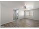 Living room showcasing modern flooring, bright natural light, and ceiling fan at 7101 N 36Th Ave # 102, Phoenix, AZ 85051