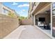 Private brick patio offers a relaxing outdoor space, with views of the living room through sliding glass doors at 7472 E Paraiso Dr, Scottsdale, AZ 85255