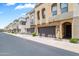 Contemporary townhome exterior with private garages and well-maintained landscaping at 7472 E Paraiso Dr, Scottsdale, AZ 85255