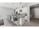 Modern kitchen with an island, stainless steel appliances, and sleek gray accents at 7472 E Paraiso Dr, Scottsdale, AZ 85255
