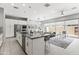 Modern, open-concept kitchen featuring stainless steel appliances and a large island at 7472 E Paraiso Dr, Scottsdale, AZ 85255