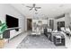 Well-lit living room offering an open concept layout with modern décor and sleek TV console at 7472 E Paraiso Dr, Scottsdale, AZ 85255