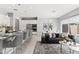 Bright living space with an open floor plan, modern decor, and a view of the kitchen at 7472 E Paraiso Dr, Scottsdale, AZ 85255