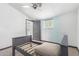 Small bedroom featuring a gray bed frame, carpet, and natural light at 8132 E 3Rd Ave, Mesa, AZ 85208