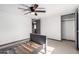 Bright bedroom featuring a ceiling fan, neutral color scheme and minimalist decor at 8132 E 3Rd Ave, Mesa, AZ 85208