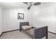 Bedroom with a gray bed frame, ceiling fan and neutral carpet at 8132 E 3Rd Ave, Mesa, AZ 85208