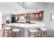 Contemporary kitchen with a breakfast bar and barstool seating at 8132 E 3Rd Ave, Mesa, AZ 85208