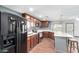 Well-equipped kitchen with modern appliances, ample countertop space, and wood cabinets at 8132 E 3Rd Ave, Mesa, AZ 85208