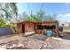 A large outdoor shed sits on the property grounds at 8132 E 3Rd Ave, Mesa, AZ 85208