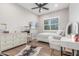 Stylized bedroom with wood-look flooring, natural light, and unique decor at 8725 E Menlo Cir, Mesa, AZ 85207