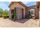 Entrance featuring a paver porch and stacked stone pillar at 8725 E Menlo Cir, Mesa, AZ 85207