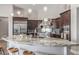 Modern kitchen featuring stainless steel appliances, granite countertops, and an island with seating at 8725 E Menlo Cir, Mesa, AZ 85207