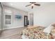 Bright main bedroom with a tv on the wall and sliding glass door at 8725 E Menlo Cir, Mesa, AZ 85207