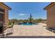 Beautiful pool area featuring desert landscaping and a relaxing spa, creating a serene outdoor oasis at 8725 E Menlo Cir, Mesa, AZ 85207