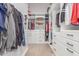 Spacious walk-in closet with custom shelving and drawers for organized storage at 8725 E Menlo Cir, Mesa, AZ 85207