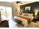 Bedroom with access to balcony and accented with modern design and décor at 9451 E Becker Ln # 1051, Scottsdale, AZ 85260