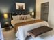 Bedroom with a queen bed, stylish headboard, accent wall and a walk in closet at 9451 E Becker Ln # 1051, Scottsdale, AZ 85260