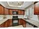 Well-maintained kitchen with granite counters, stainless steel appliances, and classic wood cabinetry at 9451 E Becker Ln # 1051, Scottsdale, AZ 85260