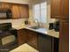 Kitchen features granite counters, stainless steel appliances, and wood cabinets at 9451 E Becker Ln # 1051, Scottsdale, AZ 85260